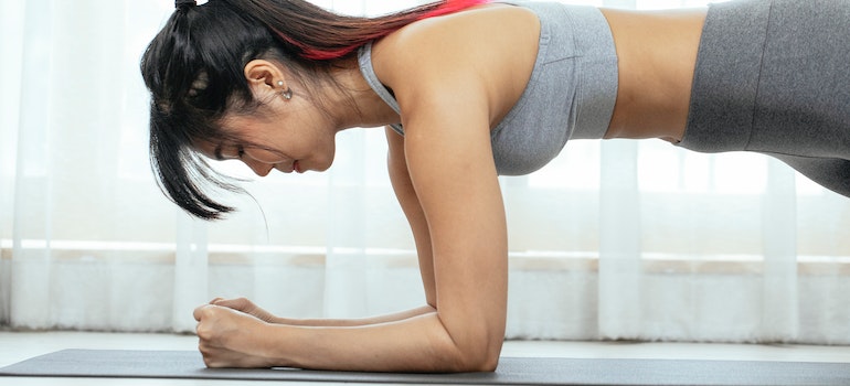 A woman doing a plank representing effective workouts you can do at home