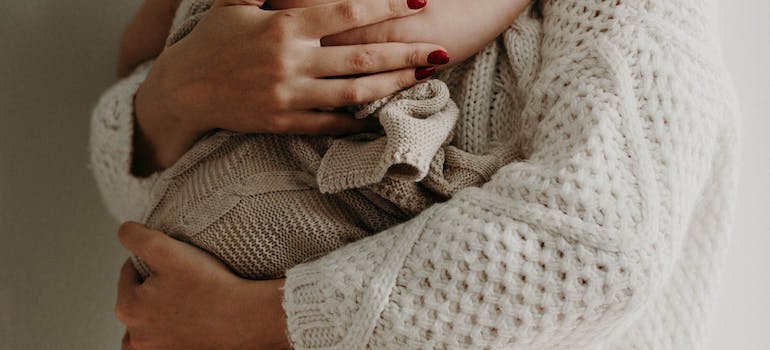 a mom holding her baby