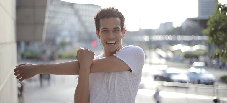 Smiled man warming up