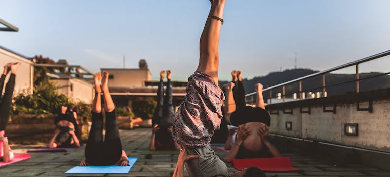 women practicing yoga, one of the best both outdoor and indoor workouts in Abu Dhabi