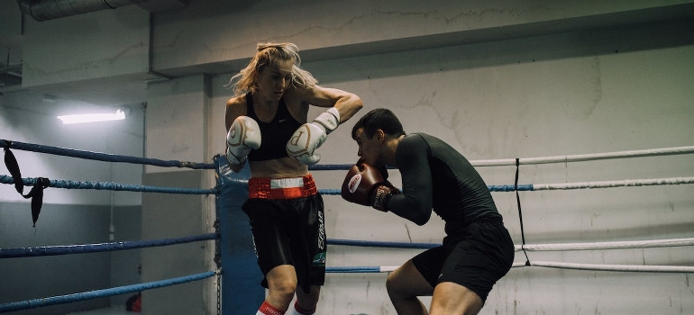 Two people doing boxing - and talking about the latest fitness training trends in the UAE.