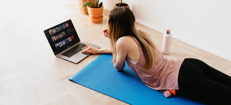 A woman researching how to set realistic fitness goals