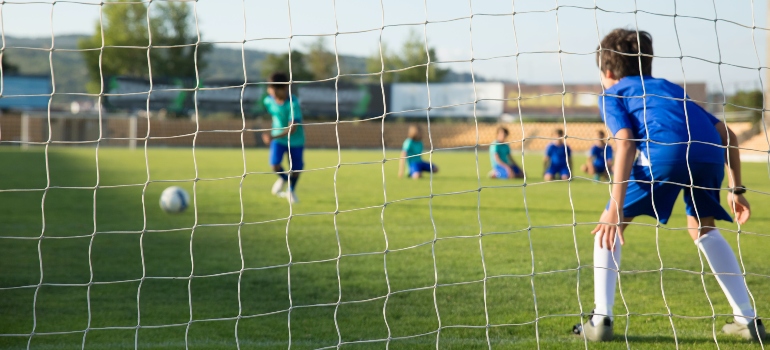 A young man on the goal.