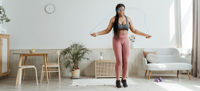A woman working out in her home.