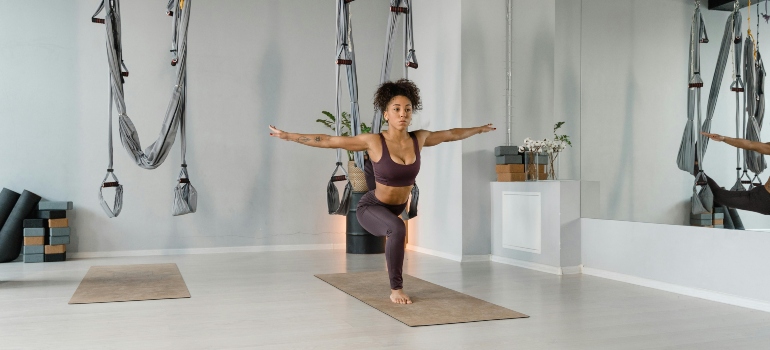 A woman streching aon a machine.