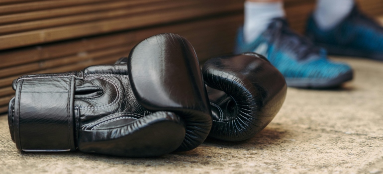 Boxing gloves on the floor.