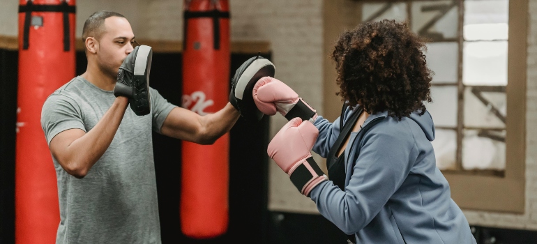 A woman working out with a personal trainer.