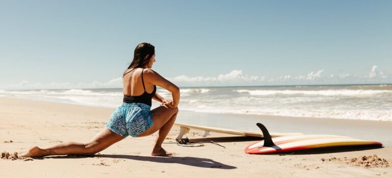 A woman exercising at the beach