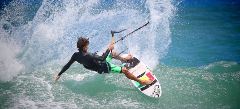 Person Riding Surf Board