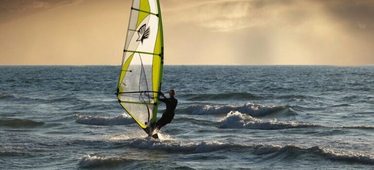 person trying windsurfing Dubai offers