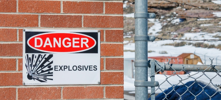 Warning sign on a brick wall