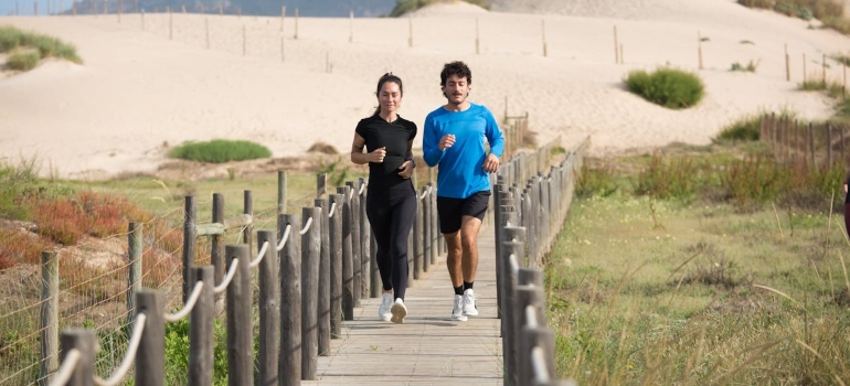 a couple running on the beach