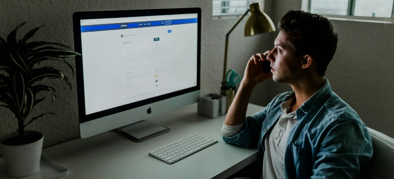 Person working at a desk and researching the best flexibility drills for desk workers in Dubai