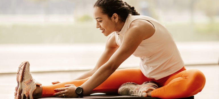 Person doing a hamstring stretch