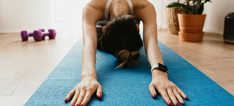Girl on a mat at home doing a workout