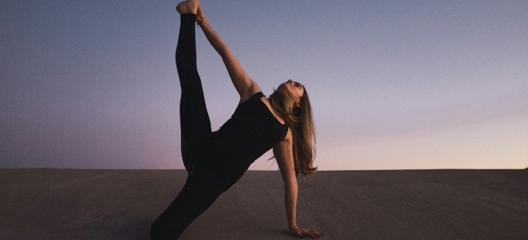 Woman doing yoga for weight loss in Abu Dhabi