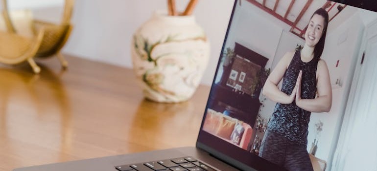 A woman working out during an online personal training in Dubai