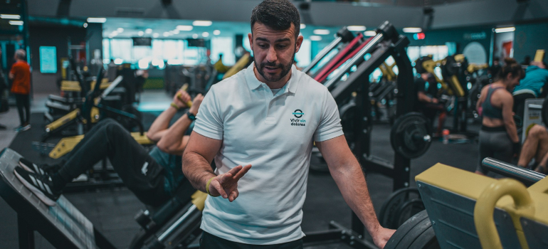 Fitness trainer helping a client