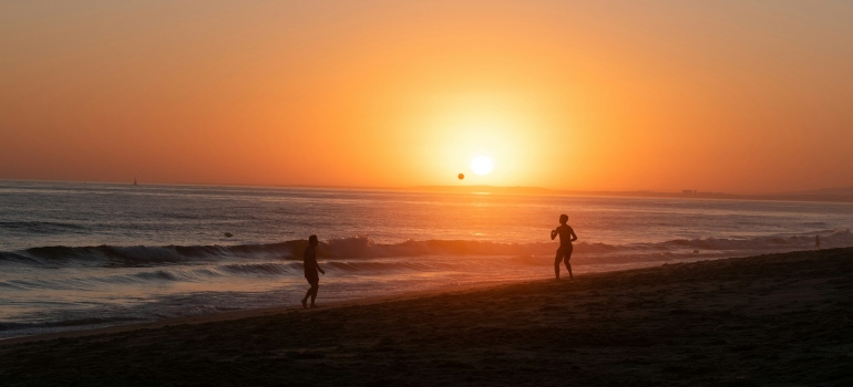 People enjoying easy beach workout routines in Dubai