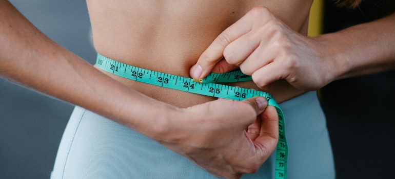 Measuring body size to track fitness progress.