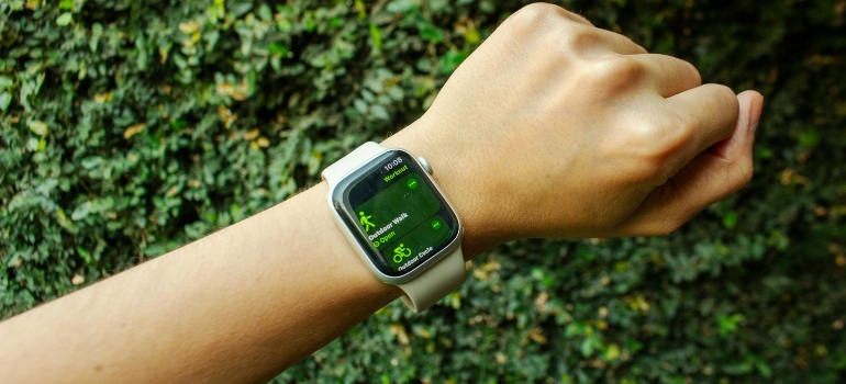 Person thinking about how wearable tech is changing personal training in the UAE