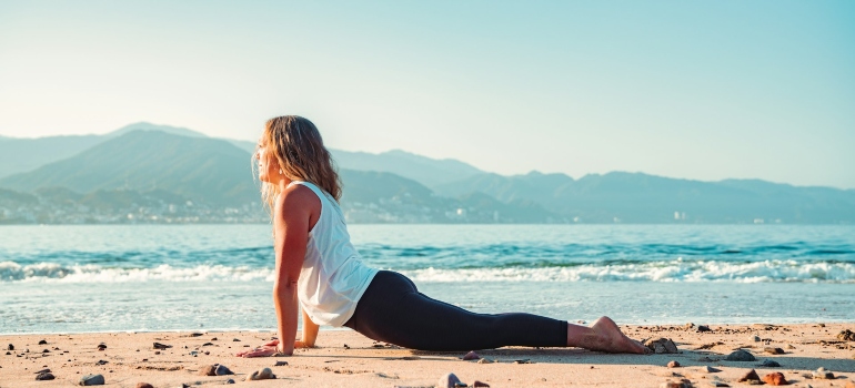 Person enjoying the benefits of training on the beach in Fujairah