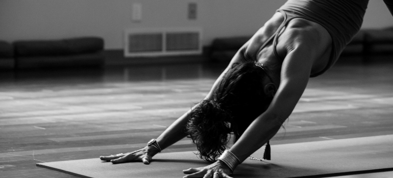 Person doing yoga as part of their weekend fitness guide for busy professionals in Dubai