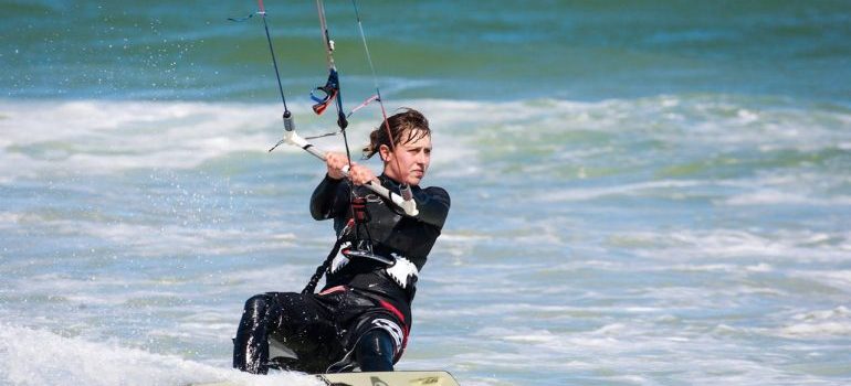 Kitesurfer on Body of Water after reading about How to Choose Your First Kitesurfing Board in Dubai