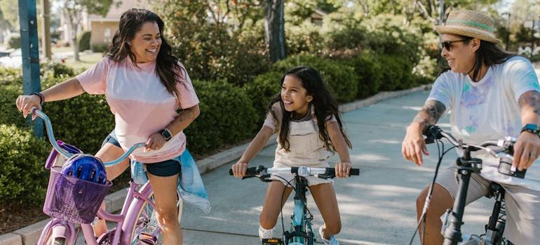 a family cycing as a great family fitness ideas for weekends in Sharjah