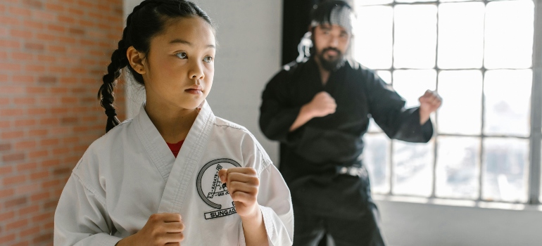 kid in White Button Up Shirt Standing Beside Man in White Dress Shirt