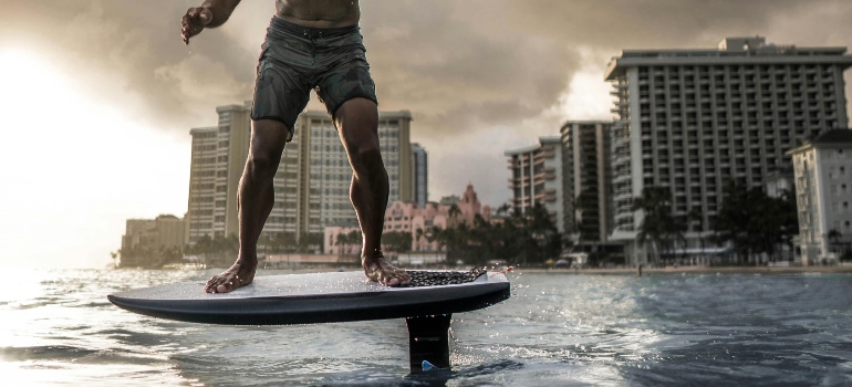 A man is practicing E-foiling on Dubai beach.