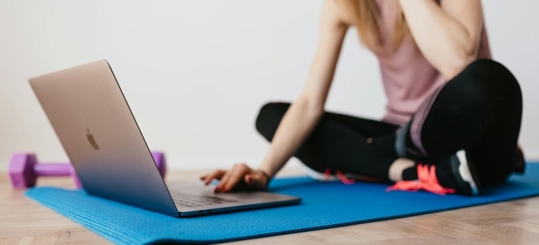 Woman using laptop to track progress