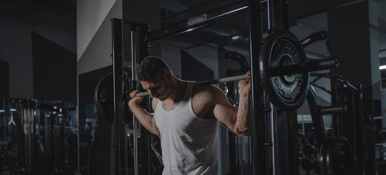 A Man Working Out at the Gym